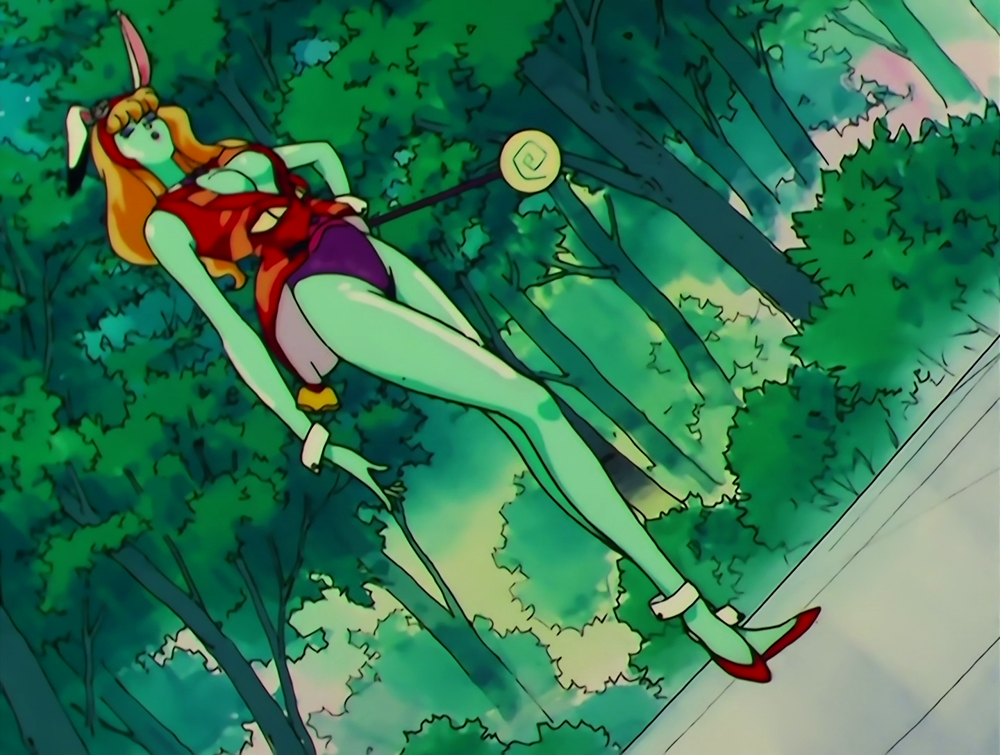 Now PeroPero has taken on a human-like form. Her skin is turquoise and she has long blonde hair. Her outfit resembles that of a Playboy bunny girl, albeit made of candy wrapper, and she still has the rabbit ears. She holds a lollipop wand. This still isn’t super normal, but it’s as normal as this monster is going to get.